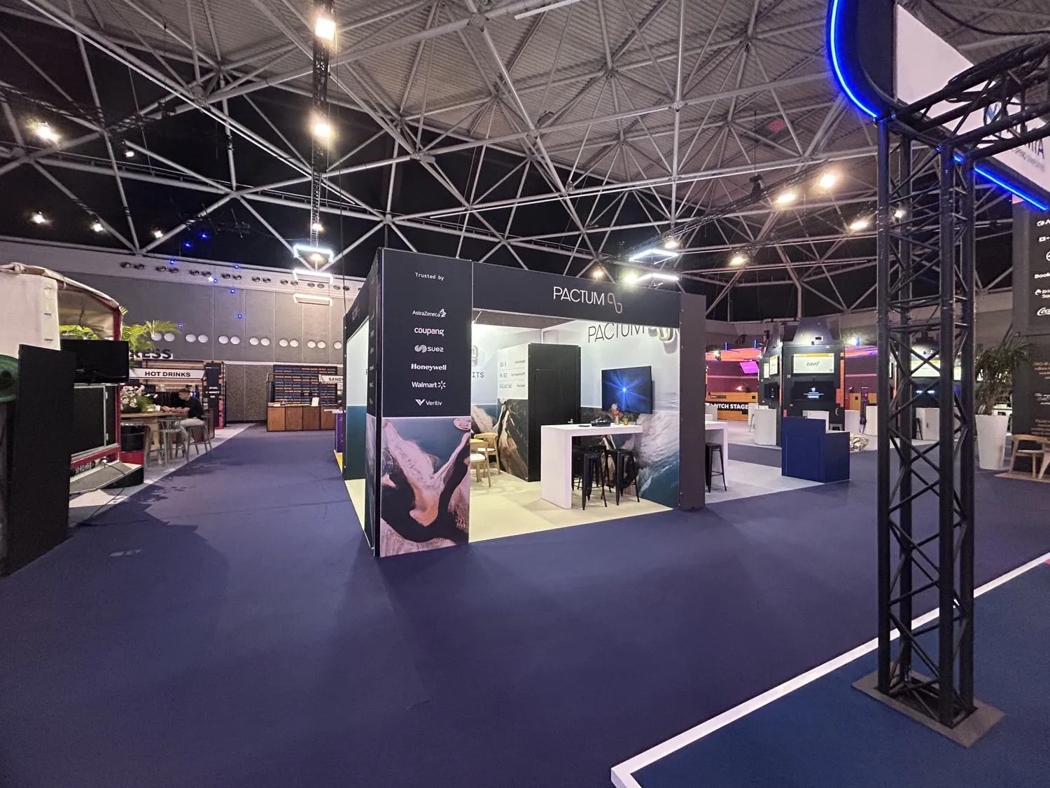 The expo hall at DPW Amsterdam 2026 with the Pactum stand in the foreground