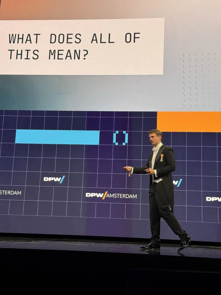 A slide on the center stage reading What does all of this mean